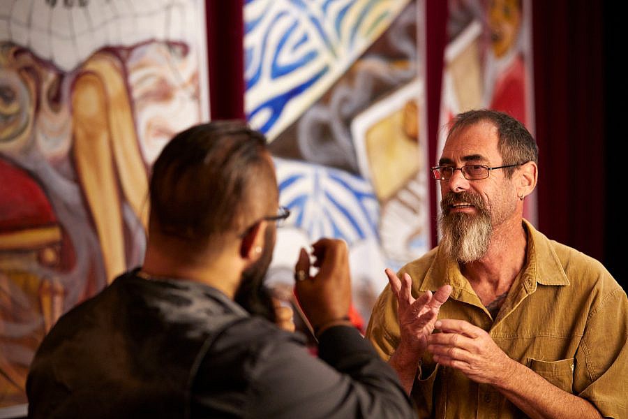 Two people communicating in Auslan