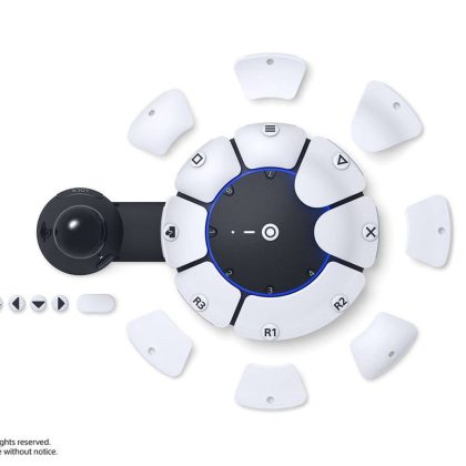 Image of the new PlayStation 5 adaptive game controller Black base in the shape of a frying pan, with white inter changable buttons that interconnect with the base arfe scattered around the outside and on top of the housing unit. 