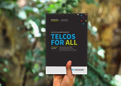 Person holding Telcos for All brochure up for display