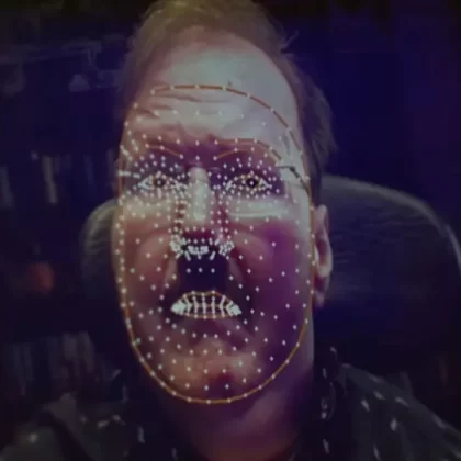 Image of Lance Carr's face, a white man with a mustache. Over his face are white mapping dots, that are used for the gamer mouse.