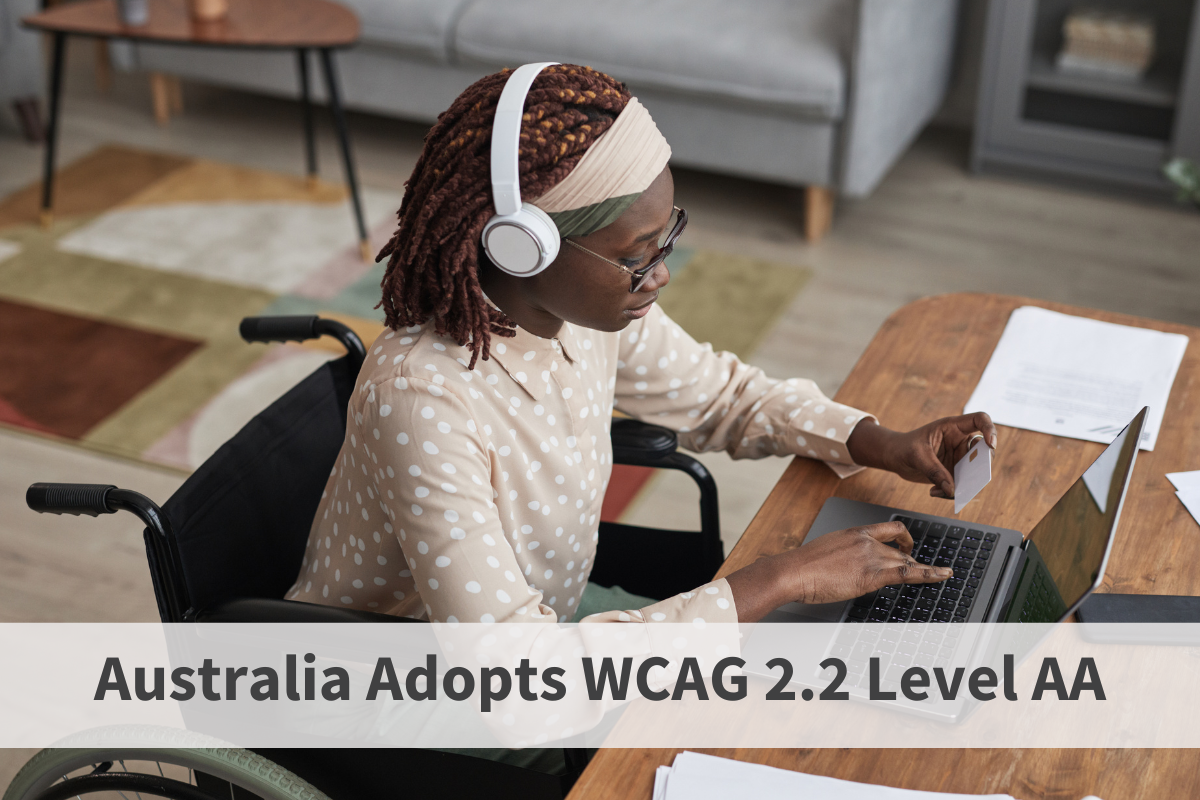 A woman, wearing headphones, is seated at a desk typing on a laptop. The text sats Australia adopts WCAG 2.2 Level AA. 