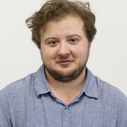 Jordan Guest, wearing a light blue polo shirt.