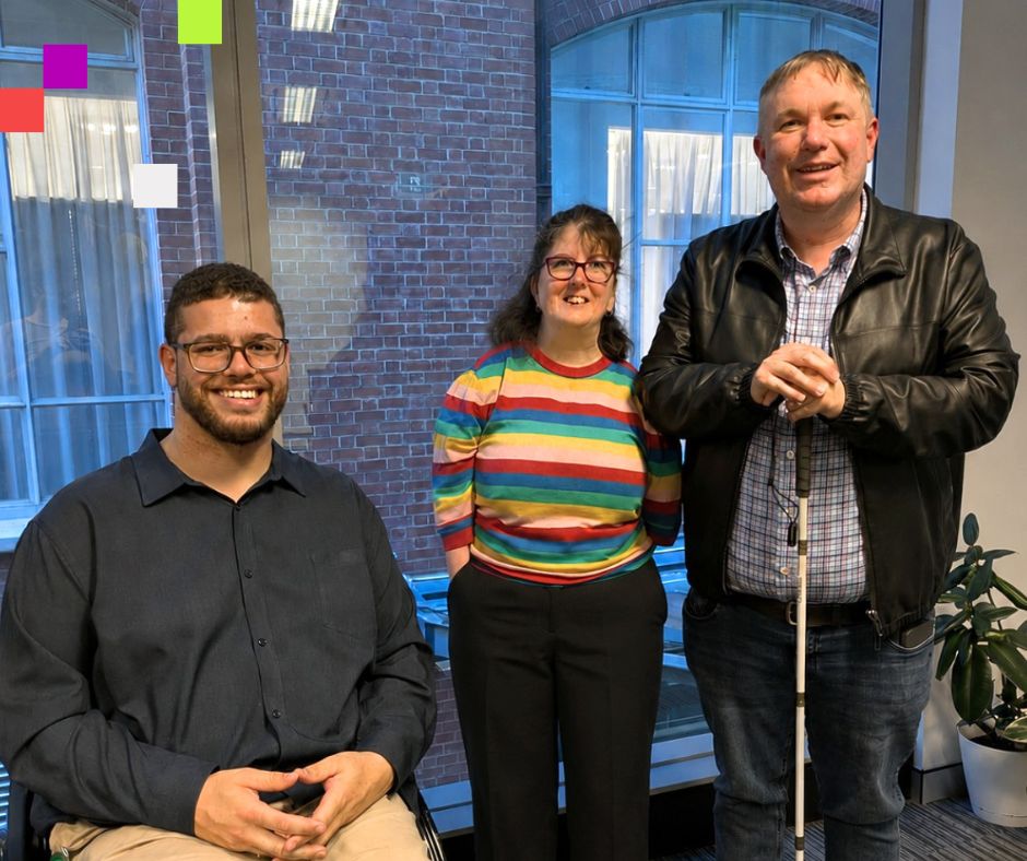 Three people posing indoors near a window and smiling at the camera. From left to right, Senator Jordon Steele John, Laetitia Thompson and Dr. Scott Hollier.