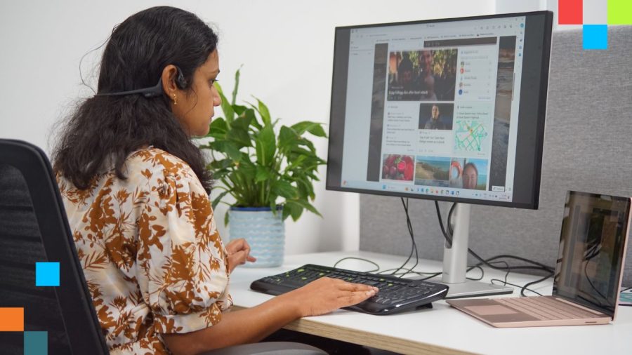 Graphic image of Aarthi Gurunathan using a computer with a headset earphone.